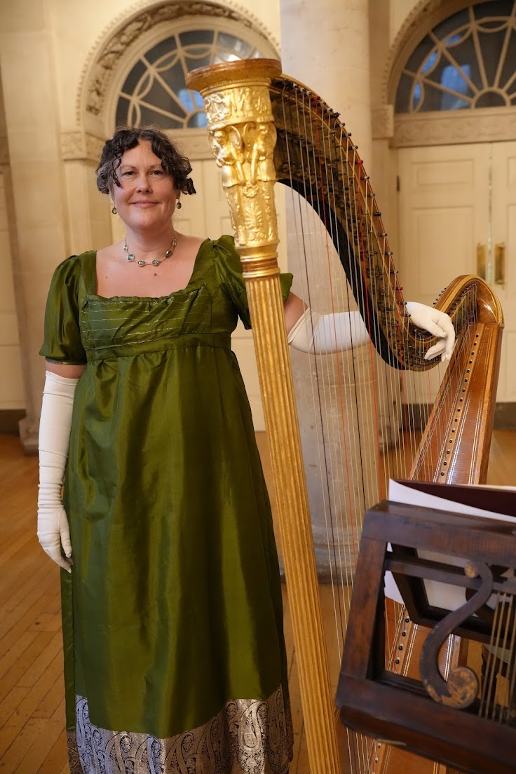 Annemarie performing with harp